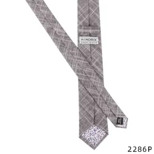 Detail view of men's casual cotton linen tie back label and floral tipping lining texture.