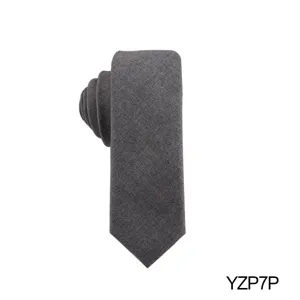 Dark grey textured men's jacquard tie, elegant business suit necktie detail shot.