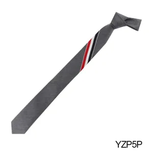 Grey narrow necktie detail view featuring distinctive red, white and black diagonal stripe design.