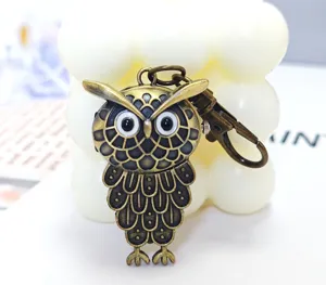 Vintage bronze owl pocket watch keychain, unique retro metal pendant gift for daily use.