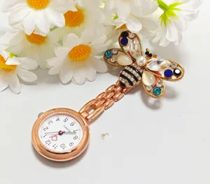 Alloy bee nurse fob watch with sparkling crystals and quartz movement close up detail view.
