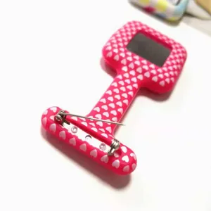 Pink silicone nurse fob watch with white heart pattern, portable medical pocket watch.