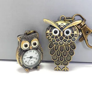 Vintage bronze owl pocket watch and keychain set with quartz movement and clear dial display.