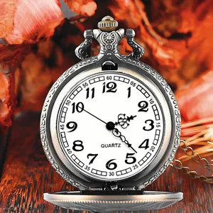 Vintage quartz pocket watch fine detail showcasing intricate engraved case and dial.