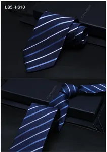 Detailed view of dark blue striped silk tie, showcasing fine fabric texture and luxury gift box.