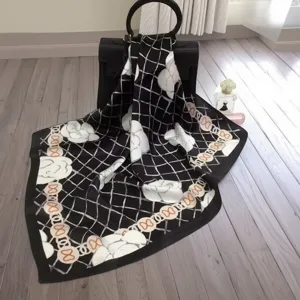 Black and white silk square scarf with floral print, luxury design for women styling and gifts.