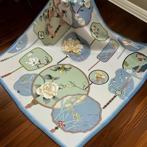 Elegant silk square scarf featuring traditional floral and fan print, soft and versatile accessory.
