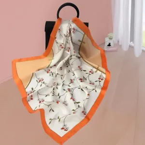 Silk square scarf for women, elegant floral print with orange border, versatile accessory.