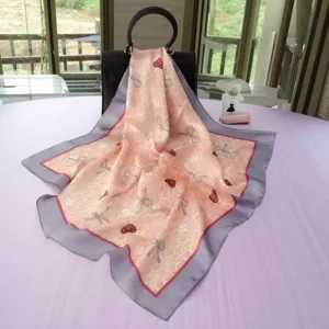 Luxury silk square scarf for women, elegant pink print design with grey border for stylish accessory.