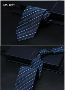 Detail view of men's silk striped jacquard tie, elegant blue and green professional wear.