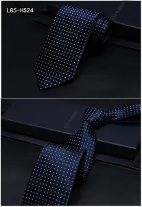 Men's navy blue silk polka dot tie detail shot, showing exquisite business formal design.