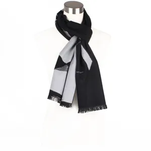 Elegant black and grey patterned scarf with fringed ends, perfect for autumn and winter wear.