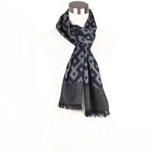 Geometric pattern winter scarf detail, soft jacquard fabric with elegant fringe edge design.