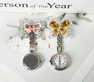 Rhinestone butterfly nurse watch detail, pocket watch with brooch pin and crystal quartz dial.