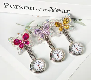 Crystal butterfly nurse watch detail, sparkling rhinestone pocket watch fob close up.