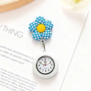 Blue checkered flower nurse fob watch detail view, silicone retractable clip pocket watch.