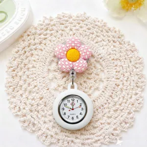 Cute pink plaid flower nurse watch featuring silicone retractable badge reel pocket.