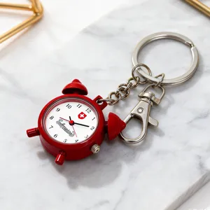 Red miniature alarm clock keychain watch with cute quartz dial and durable metal ring clasp.