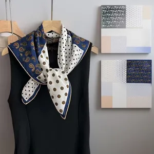 Silk square scarf featuring a chic contrast design with classic paisley and polka dot prints.