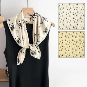 Silk square scarf featuring elegant panda and bamboo print, perfect detail view for outfits.
