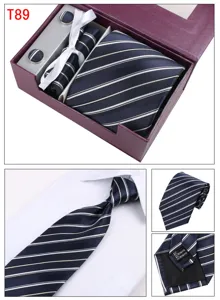 Detailed view of men's formal striped tie set with cufflinks, pocket square and gift box.