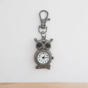 Owl shape quartz pocket watch detail view with keychain hook and clear numerals dial.