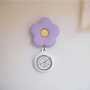Close-up of purple flower silicone nurse watch dial detail, cute quartz pocket fob watch.