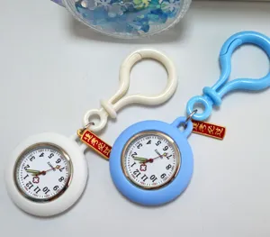 Detailed shot of portable quartz nurse watch with clip and exam charm, clear dial display.