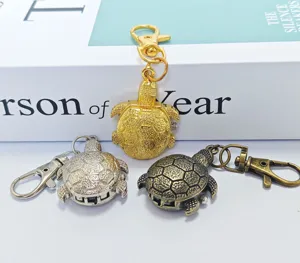 Detailed view of cute turtle pocket watches in gold, silver, and antique bronze finishes.