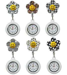 Cute silicone nurse watch with retractable badge reel and smiley flower pattern dial.