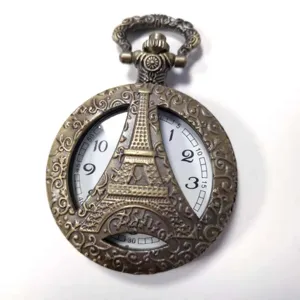Orologio da tasca vintage in bronzo con design torre Eiffel e numeri del quadrante.