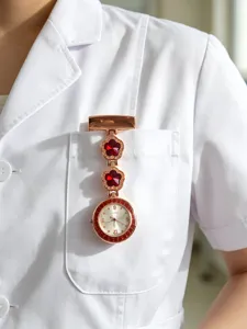 Elegant rose gold nurse fob watch with red crystal clover design for medical professionals.