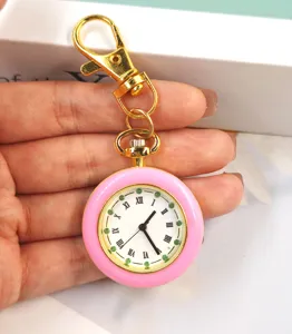 Mini orologio tascabile al quarzo rosa macaron portachiavi con quadrante bianco numeri romani.