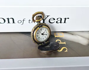 Vintage bronze pocket watch with hollow zodiac carving, portable quartz timepiece for gifts.