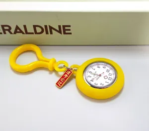 Yellow silicone nurse pocket watch with student exam charm, portable quartz timepiece.