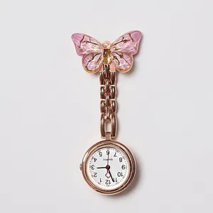 Close-up detail of the sparkling pink gradient crystal butterfly nurse pocket watch dial.