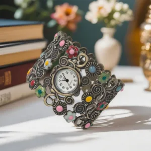 Vintage ethnic style cuff watch with colorful floral enamel design and quartz movement.