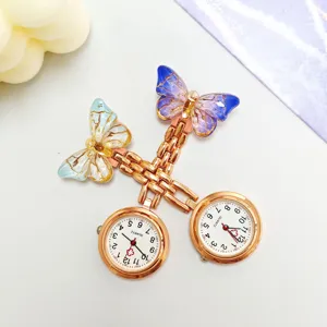 Charming crystal gradient butterfly nurse watch detail, elegant quartz pocket watch design.