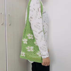 Green knitted crochet flower tote bag, stylish hollow shoulder bag for women daily wear.
