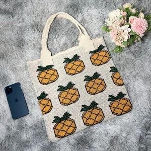 Knit pineapple tote bag detail view showcasing soft fabric texture and cute pattern design.
