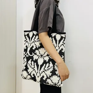 Schwarze und weiße gestrickte Tragetasche für Damen, lässige Handtasche mit Blumenmuster.
