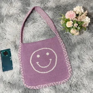 Lila gestrickte Umhängetasche mit niedlichem Smiley-Muster, lässige gewebte Tasche.