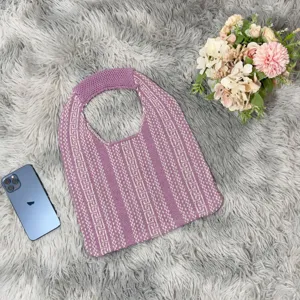 Detail view of the purple and white geometric knit tote bag, stylish underarm shoulder bag.