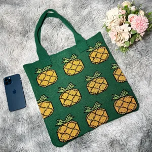 Green knit tote bag with yellow pineapple pattern, stylish casual single shoulder bag for women.