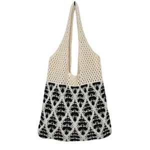 Schwarze weiße Strick Handtasche, elegante Schultertasche mit Muster im Hohlmuster Design.