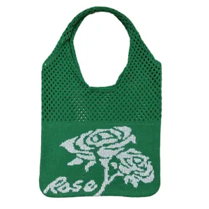 Grüne Strick-Tasche mit weißem Rosenmuster, hohles Mesh-Design, stilvolle lässige Damentasche.