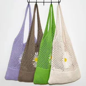 Detailansicht von Damen Strick Häkelnetz Schulter Handtaschen mit schönen Gänseblümchen.