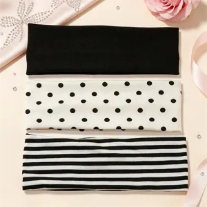 Detail view of elastic headbands featuring solid black, polka dot, and striped patterns for sports.