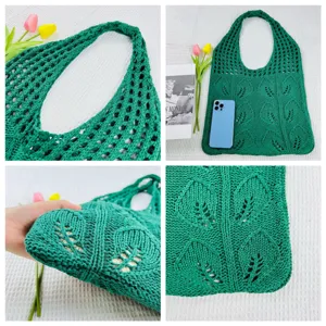 Grüne gestrickte Tasche Detailansicht mit durchbrochenem Blattmuster und Schulterriemen.