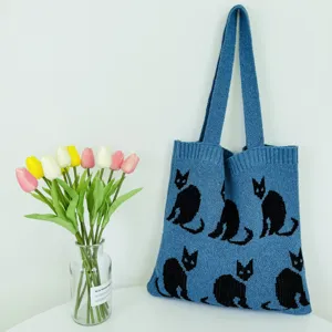 Blaue Strick-Tragetasche mit süßem schwarzem Katzenmuster, lässige Umhängetasche für Damen.